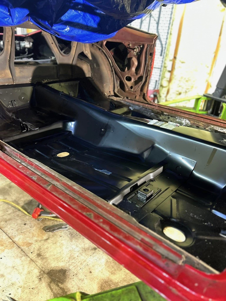 Replacement floor pan and rocker panel fabrication on a muscle car shell