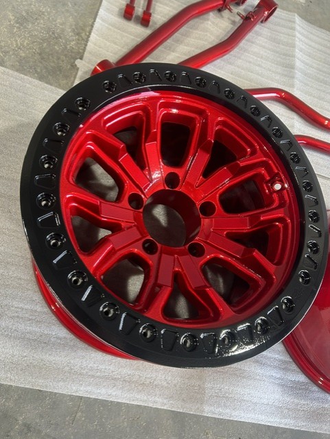 Custom red and black beadlock wheel